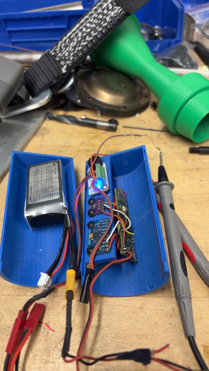 Avionics pod under power at the bench during integration checkout